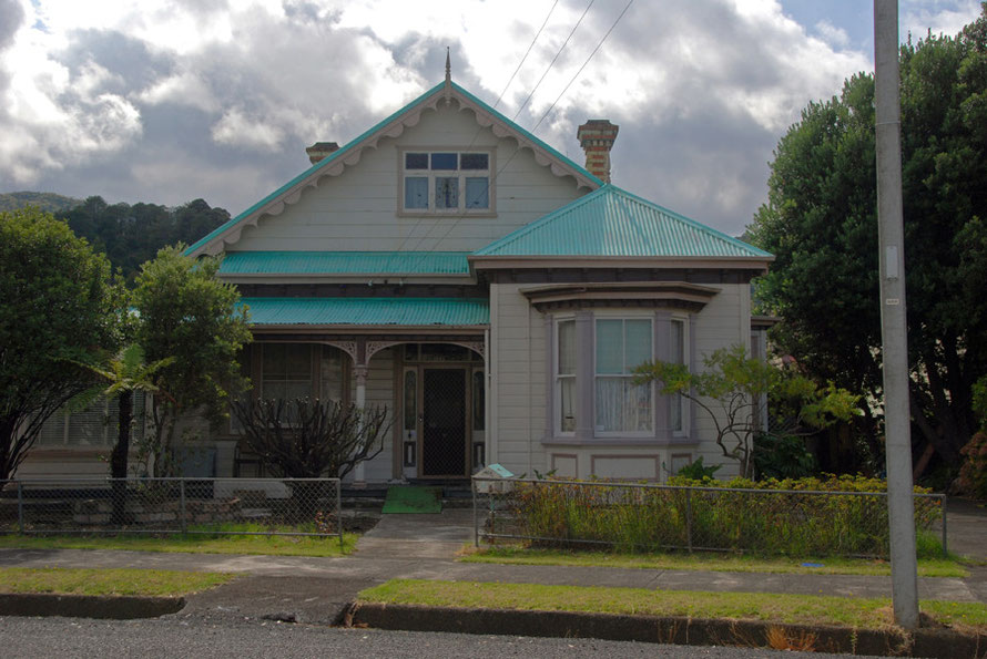 Turquoise on grey - tin roofed colonial villa in Thames. 