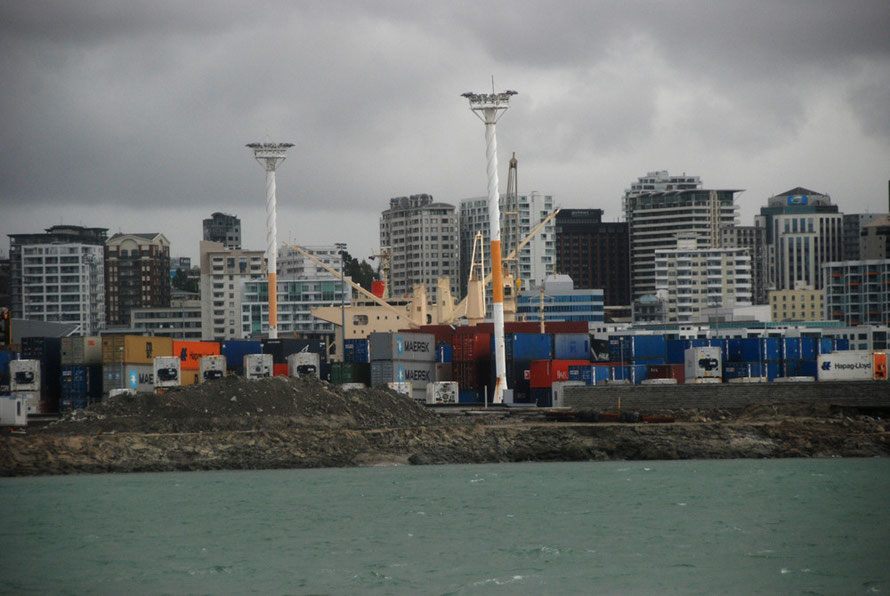 The container terminal at Auckland port and bulk carrier Hanjin Iwagi unloading coal. 