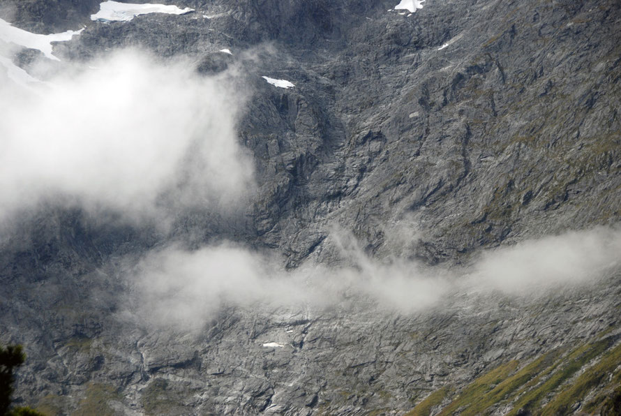 The sheer rock walls of Mt Christina on the Milford Road.