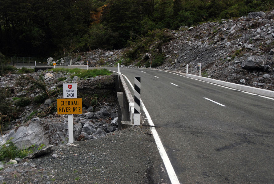 The steep climb up to the Western portal of the Homer Tunnel with more evidence of huge rockfalls cleared off the Milford Road.