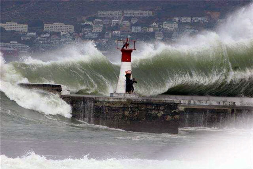 Massive waves at Kalk Bay in 2008 and intrepid photographers (copyright unknown)