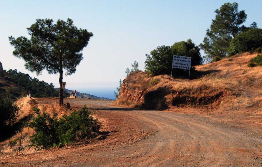 Entrance to a UNFICYP post on the Green Line.  The sign reads, 'Welcome to Alfa Co[mpan]y. You are in Area 40.  You need track free in Channel 16 to Oscar 18