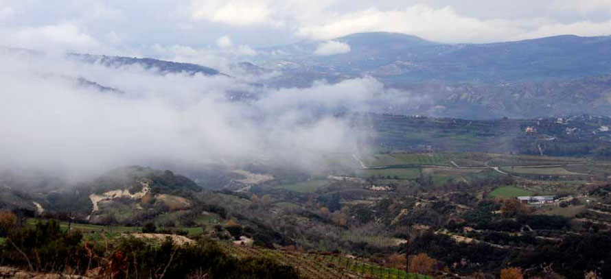 A patchwork of valleys, plateaus, green fields,  near Kathikas