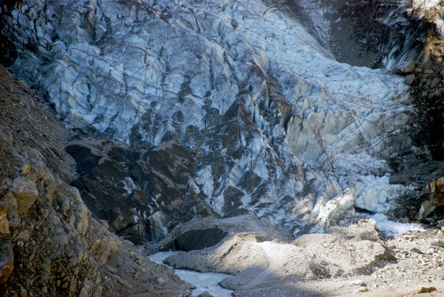 The Fox Glacier terminus and the glacier river flowing through the gap in the buried ice pictured above