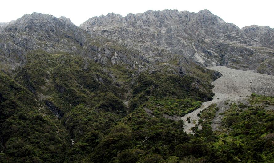 The grim valley walls and jagged skyine (Mt Temple 1913m/6,276ft) in swirling cloud above Authur's Pass