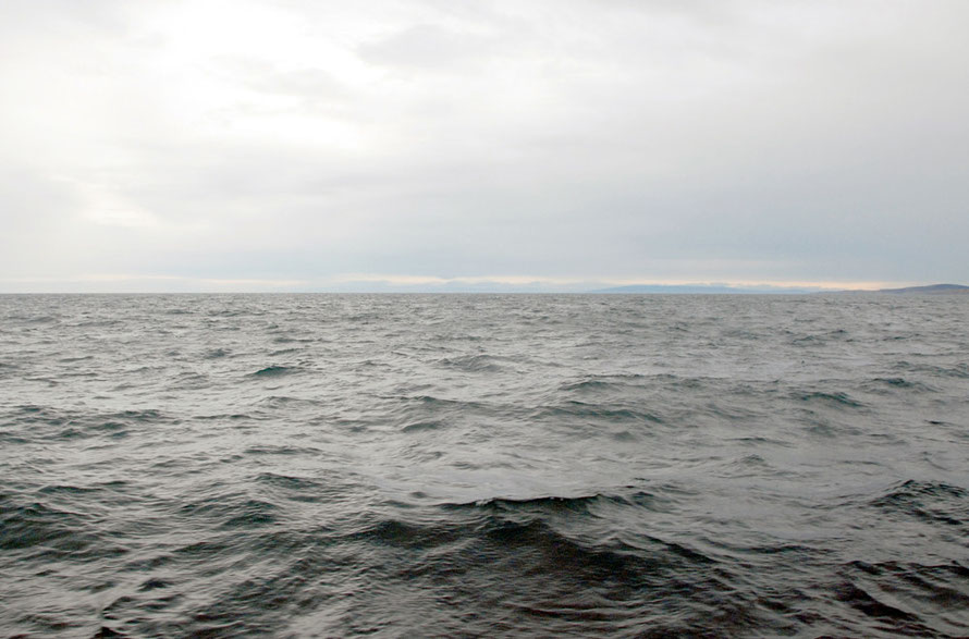 The vastness of the Pacific Ocean: view back to the New Zealand mainland from the Foveaux Strait between Bluff and Stewart Island