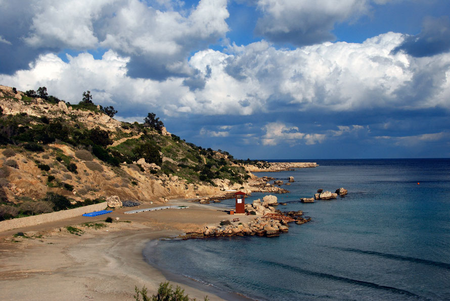 Kornos Bay, empty and delightful in Janaury 2013 but for the Grecian Park Hotel towering above it