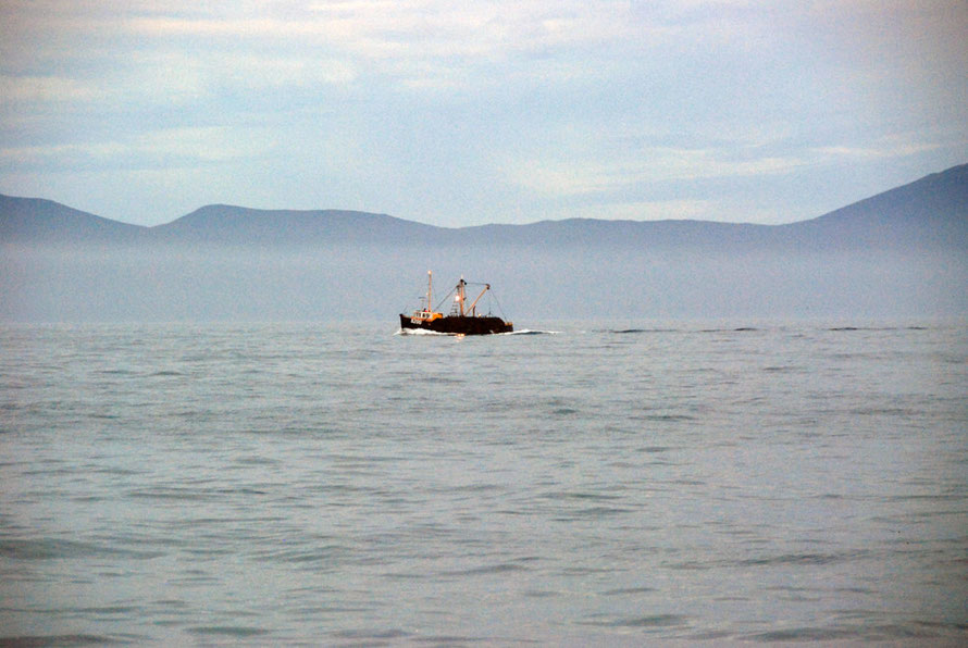 Oyster Boat (possibly) dredging for the sought-after Bluff Oyster in the Foveaux Strait with Stewart Island/Rakiura in the background.