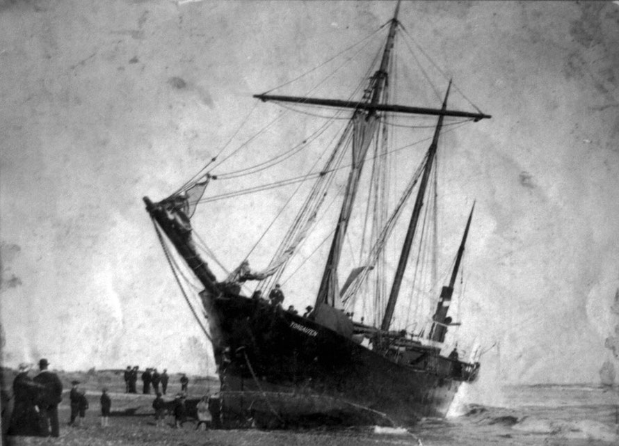 The steamer, Torgauten, stuck fast on the Hokitika bar in 1904. She was refloated tow months after having grounded through a fouled propeller (Hokitika Museum)