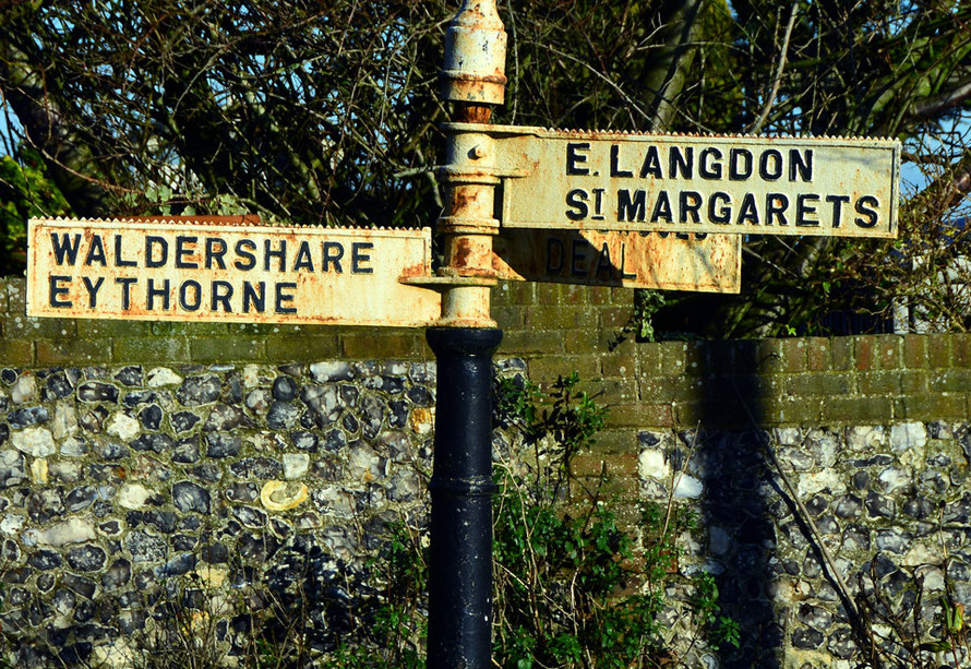 Road sign and flint wall in West Langdon in January sunshine, 2015. 