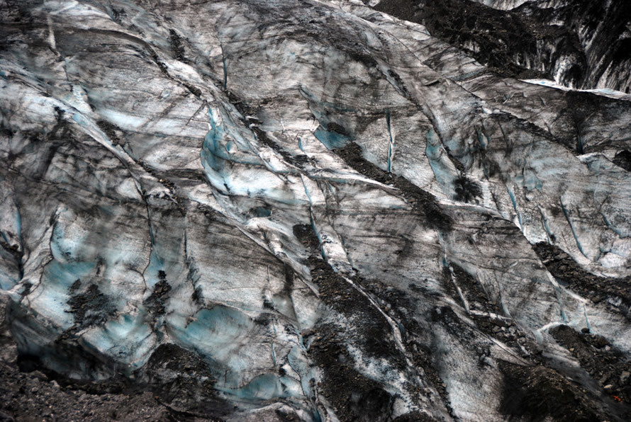 Eroded ice and ground rock at the terminus of the Fox Glacier: summer surface melting averages 129mm a day reducing to 22mm in winter.