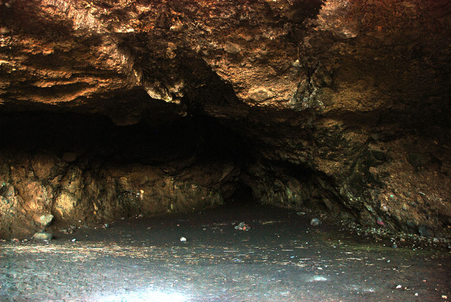 Cave near Sargent Point, Whatipu, Auckland. One such cave had a wooden floor insalled for danced during kauri timber boom of the 19th century. 