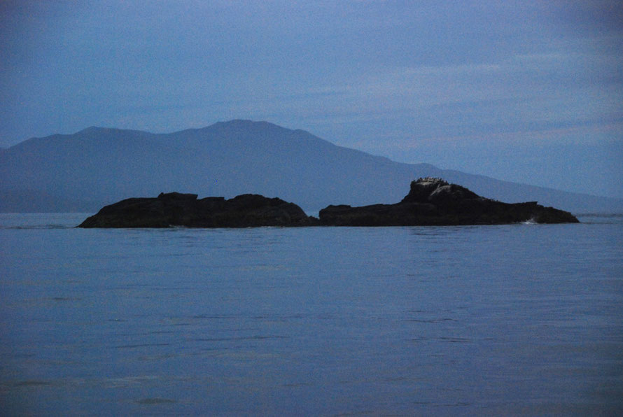 Fish Rock in different light in the Foveaux Strait.