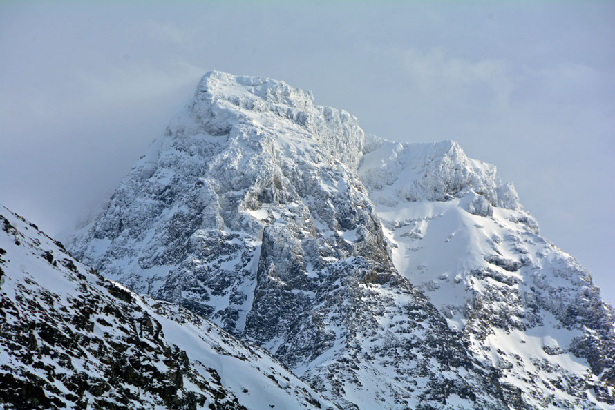 The snow and ice-bound peak of Forholtfjellet (1467m) in the southern half of the Lyngen Alps from Jøvik.