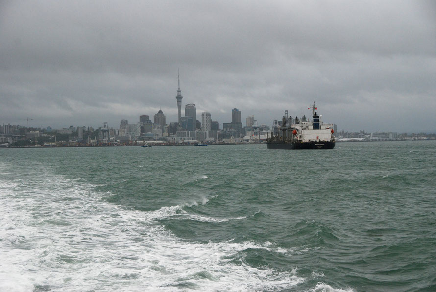 Fully laden bulk carrier 'Genco Pioneer' making for the Auckland port facilities under stormy skies after the passage of Cyclone Lusi the day before. 