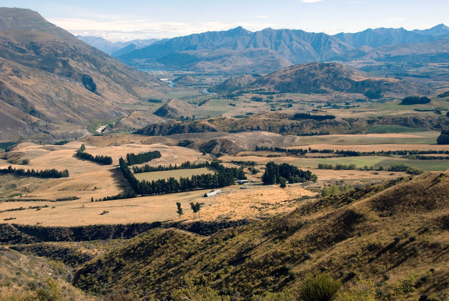 Another view looking towards Queenstown from the Crown Range with Vanguard Peak and the bends of the Kawarau River, which joins the Clutha/Mata Au at Cromwell.