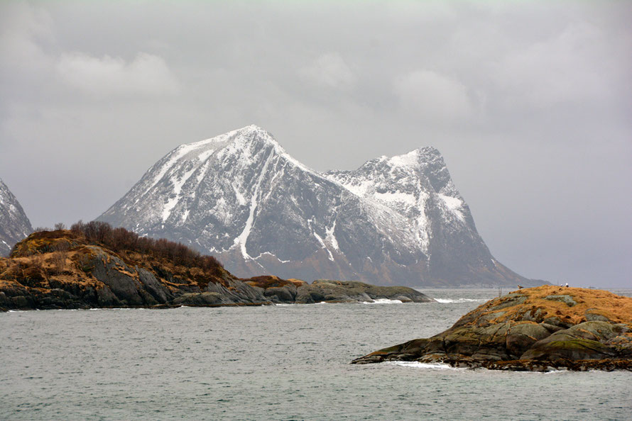 Galciation on Senja Island which is made up of ancient (2500-1750 MYA) pre-Cambrian granite, mangerite and charnockite. This is Tortenberget. At 574m it is much lower than the Lyngen Alps but still spectacular in a blocky, massive manner. 