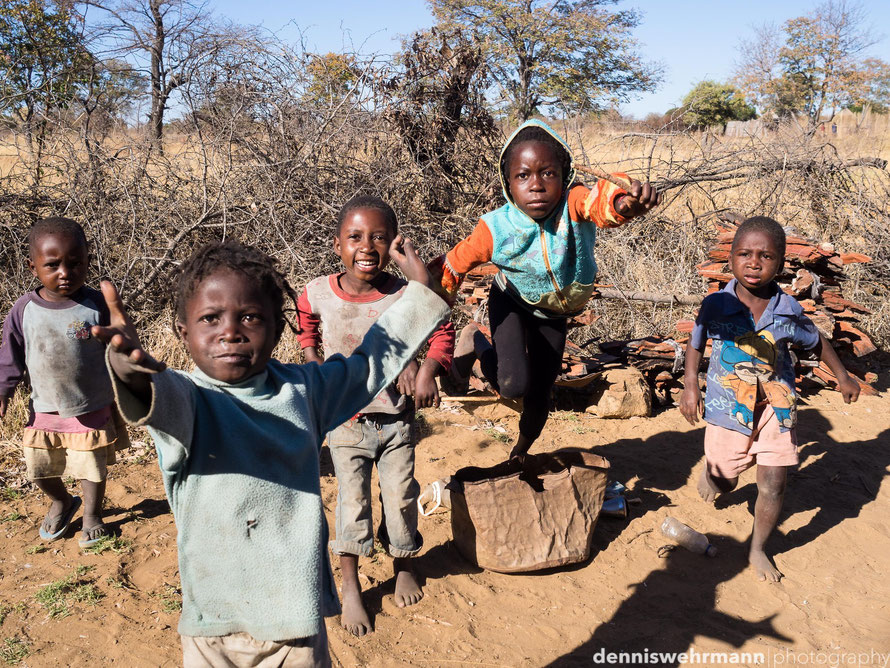  children playing the drums for some coins or food in the captive strip, namibia. poverty in the boondocks is still a heavy burden omd em-10... 17mm; f5.6; 1/640 sec.; iso 200