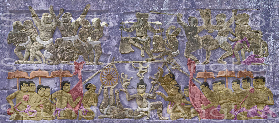 In front of the harps we can see singers competing in a vocal contest. The singers on the right express themselves vehemently while the one on the left listens while preparing his riposte. Bayon. Northen ext. gallery. 13th century