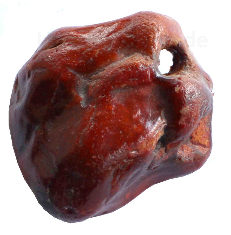 Ein sogenannter Hühnergott aus rotem Feuerstein.