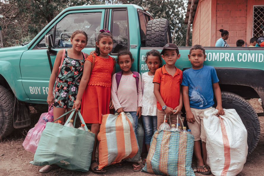 Local Community bring Plastic Bottles © BUY FOOD WITH PLASTIC 2026