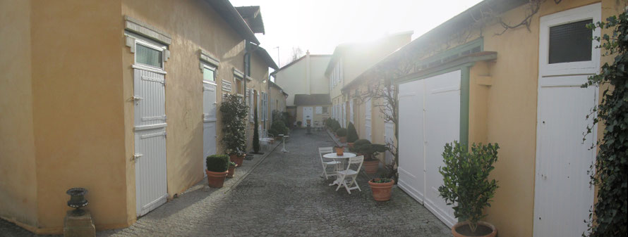 The private courtyard where the furnished rentals are located