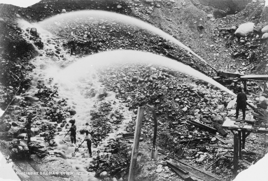 Hydraulic sluicing at Dillmanstown 15km east of Hokitika. It was dirty, wet and dangerous work (Alexander Turnbull Library, National Library of New Zealand)