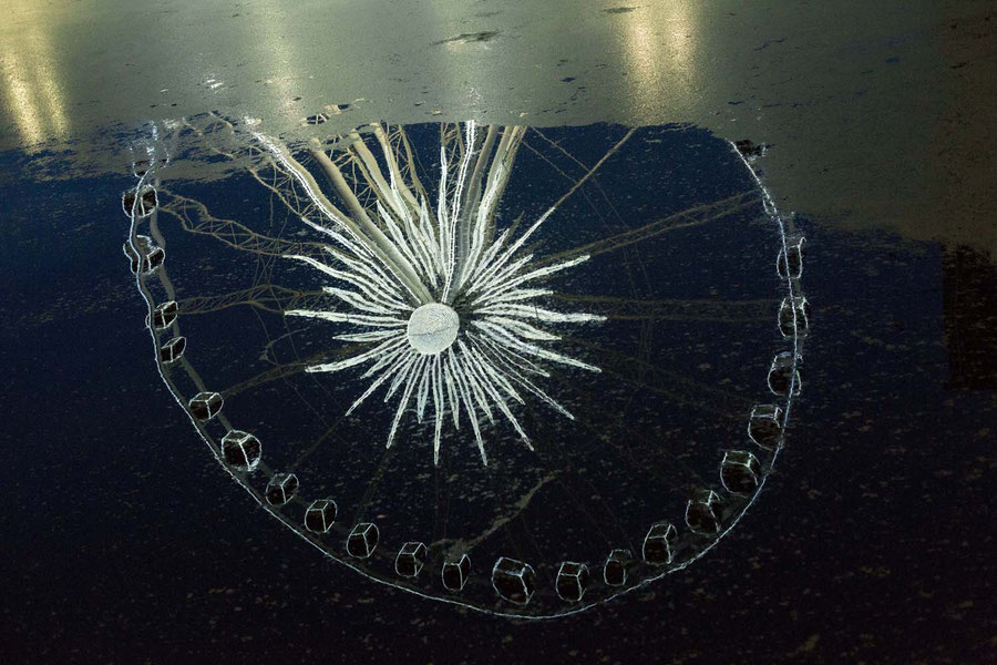 Ferrywheel in Gdansk reflected in the river