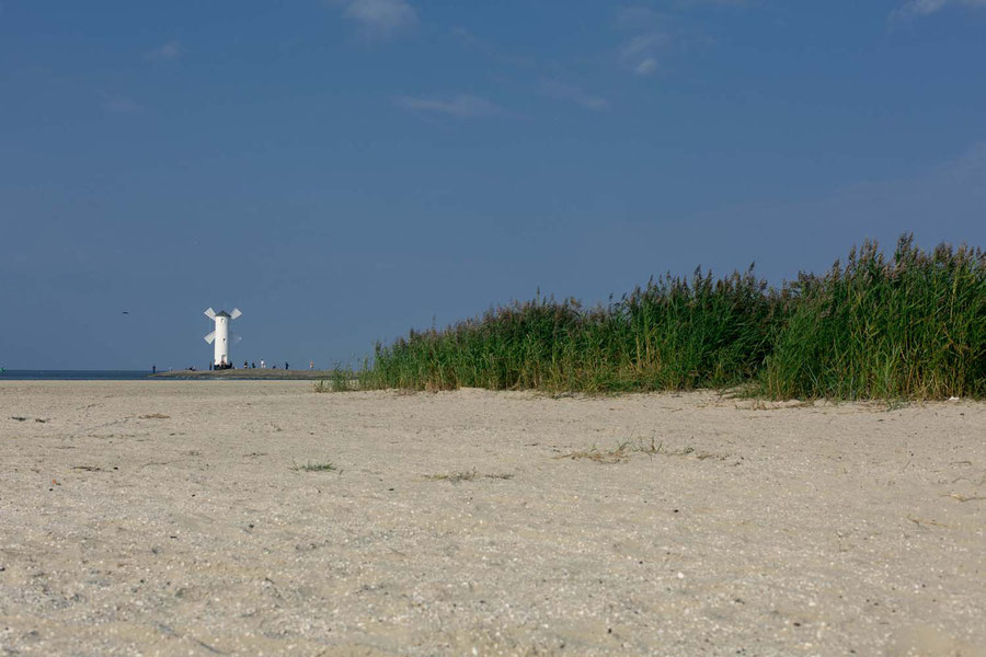 Windmill on the outmost part of the beach in Swinouscije