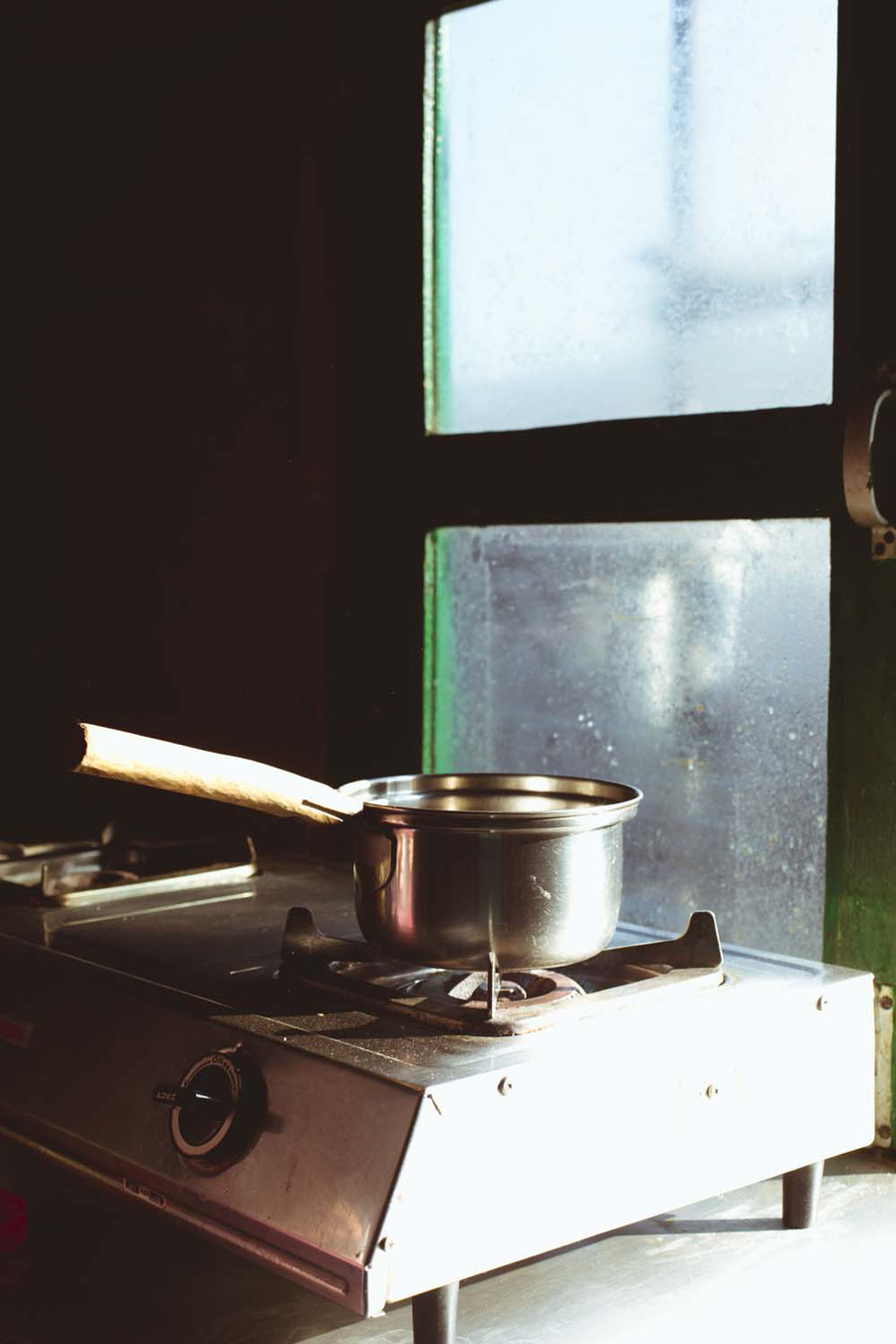 Cooking tea on a gasstove, Sister's Homestay, Nagarkot, Nepal