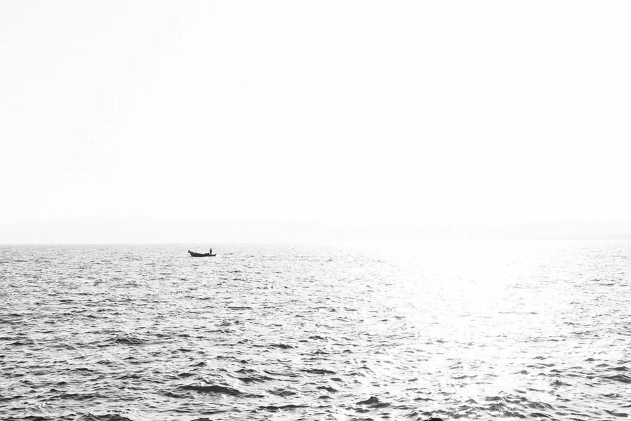 Fisher in lake Bolsena, Bolsena, Italy