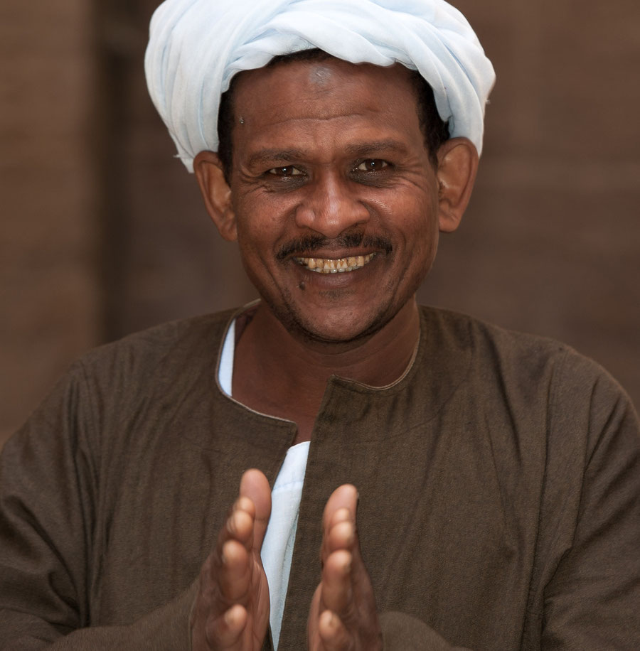 Portrait of a happy Egyptian man clapping his hands.