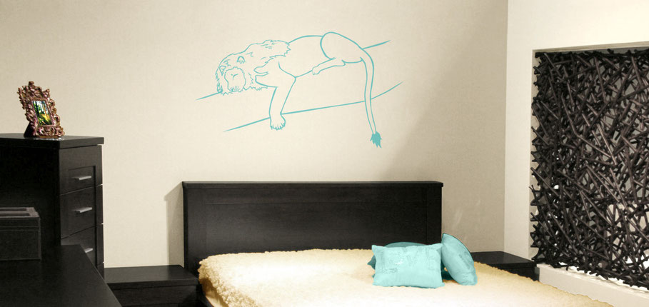 Sleeping Lion on a branch in turquoise vinyl. This king on the jungle is resting above a bed adding an accent of colour to the room. This sticker design comes in many colour options to suit any room in need of a big cat.