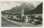 Pfarrkirche St. Peter und Paul in Sexten im Pustertal, Südtirol (erbaut 1826/27) gegen Rotwand und Elferkofel (Elfergruppe, Sextner Dolomiten). Gelatinesilberabzug 9 x 14 cm; Nic(olo). Holzer, Sesto (Sexten); postal. befördert 1931.  Inv.-Nr. vu914gs00278