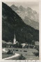 St. Jakob in Haus, Bzk. Kitzbühel, Tirol im Pillerseetal mit Pfarrkirche zum Hl. Jakob d.Ä. gegen Loferer und Leoganger Steinberge. Gelatinesilberabzug 9 x 14 cm; Verlag Ad(olf). Künz, Anichstraße 32, Innsbruck; postal. befördert 1936.  Inv.-Nr. vu914gs01