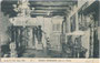 Prunkofen und Luster im Saal der ehem. Stauferburg Katzenstein in Kastelbell (heute Gemeinde Kastelbell-Tschars, Burggrafenamt, Prov. Bozen-Südtirol). Heliogravüre 9 x 14 cm; Impressum: Verlag B. PETER, Meran 1906.  Inv.-Nr. vu914hg00026