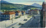 Hauptbahnhof Innsbruck am Bahnhofplatz (heute Südtiroler Platz) mit Straßenbahnhaltestelle. Photochromdruck 9 x 14 cm.; Impressum: ilhelm Stempfle, Innsbruck um 1910.  Inv.-Nr. vu914pcd00101
