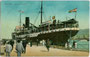 Postdampfer „Tirol“ des Österreichischen Lloyd festgemacht an der Mole San Carlo im Hafen von Triest. Kombinationsfarbdruck 9 x 14 cm; Impressum: Milan Mandich, Triest - postalisch befördert 1911.  Inv.-Nr. vu914kfd00001