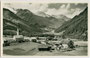 Luttach, Gemeinde Ahrntal im Pustertal mit Pfarrkirche zu den Hll. Sebastian und Rochus von Südwesten gegen die Zillertaler Alpen. Gelatinesilberabzug 9 x 14 cm; Impressum: J(ohann). F(ilibert). Amonn, Bolzano-Merano 1938.  Inv.-Nr. vu914gs01152