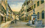 Gasthof "Kirchbergerbräu", Stadtgasse 62 und der Nepomukbrunnen in der Altstadt von Bruneck, Bezirkshauptstadt in der Gefürst. Grafsch. Tirol (1849-1919). Photochromdruck 9 x 14  cm; Impressum: Josef Werth, Toblach 1911.  Inv.-Nr. vu914pcd00326