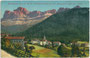 Welschnofen im Eggental mit Pfarrkirche zum Hl. Ingenuin mit der Rosengartengruppe von Nordosten. Photochromdruck 9 x 14 cm; Impressum: Joh(ann). F(ilibert). Amonn, Bozen 1910.  Inv.-Nr. vu914pcd00317