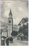 Dienstmann bei der Pfarrkirche Hll. Philipp und Jakob in Cortina, Bzk. Ampezzo, Gefürst. Grafsch. Tirol (ab 1919 Cortina d' Ampezzo, Prov. Belluno, Republik Italien). Heliogravüre 9 x 14 cm; Verlag A. Figl & Co., Bozen 1907.  Inv.-Nr. vu914hg00005