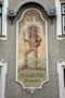 Fresko mit Darstellung eines Saltners (Weinhüter) mit Hellebarde und Schloss Tirol am Haus der ehem. Weinhandlung Benedikt FRITZ, Pradler Straße 36 in Innsbruck-Pradl. Digitalphoto; © Johann G. Mairhofer 2013.  Inv.-Nr. 1DSC06119