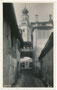 Turm aus dem 16. Jh. der nach Plänen von Leopoldo de Claricini von 1872 bis 1877 neu errichteten neoromanischen Pfarrkirche zum Hl. Erlöser in Levico, Alta Valsugana. Gelatinesilberabzug 9 x 14 cm, Verlag E.P. um 1930.  Inv.-Nr. vu914gs01185