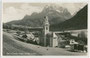 Pfarrkirche St. Peter und Paul in Sexten im Pustertal, Südtirol (erbaut 1826/27) gegen Rotwand und Elferkofel (Elfergruppe, Sextner Dolomiten). Gelatinesilberabzug 9 x 14 cm; Nic(olo). Holzer, Sesto (Sexten); postal. befördert 1931.  Inv.-Nr. vu914gs00278