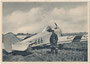 Pilot in zeitgenössischer Fliegerkleidung (u.a. Pelzstiefel und Ledermantel) vor offenem Ganzmetallflugzeug Junkers T 29, Bj. 1925 aus dem Junkers Flugzeugwerk, Dessau. Rastertiefdruck 10 x 15 cm ohne Impressum. Inv.-Nr. vu105rtd00008