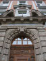 Portal im Mittelrisalit vom 1562 als Lateinschule der Jesuiten gegründeten, heutigen Akademischen Gymnasiums in Innsbruck (Planung: Philipp Mitzka 1909/10) Angerzellgasse 14. Digitalphoto, © Johann G. Mairhofer 2012.  Inv.-Nr. 1DSC04247