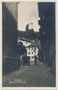 Südfassade der Stadtpfarrkirche, Pfarrplatz, ehem. Schirmfabrik und Pulverturm (Burg Ortenstein) in Meran, Alto Adige (ital. Besetzung!). Gelatinesilberabzug 9 x 14 cm; Impressum: B(ernhard). JOHANNES (1846-1899) um 1919/20.  Inv.-Nr. vu914gs01171