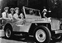 Admiral Chester William Nimitz (c), the Commander-in-Chief of the US Pacific Fleet, takes a ride around Pearl Harbor with his aides-de-camp in a willys jeep 