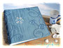 Fotoalbum Eisblume - 30cmx30cm, 100 Seiten weiß, Bezugstoff: floral bestickter Crashtaft blau, Buchschmuck: Blume aus Seeglas.